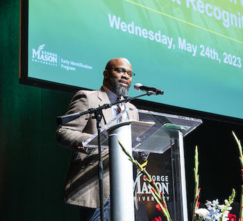 man talking at the podium